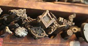 Finishing tools including the square and compass.